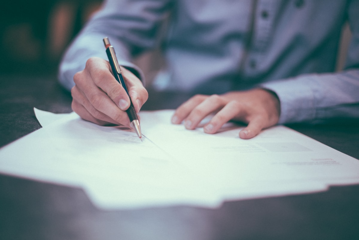 Legal documents on a desk during an acquisition